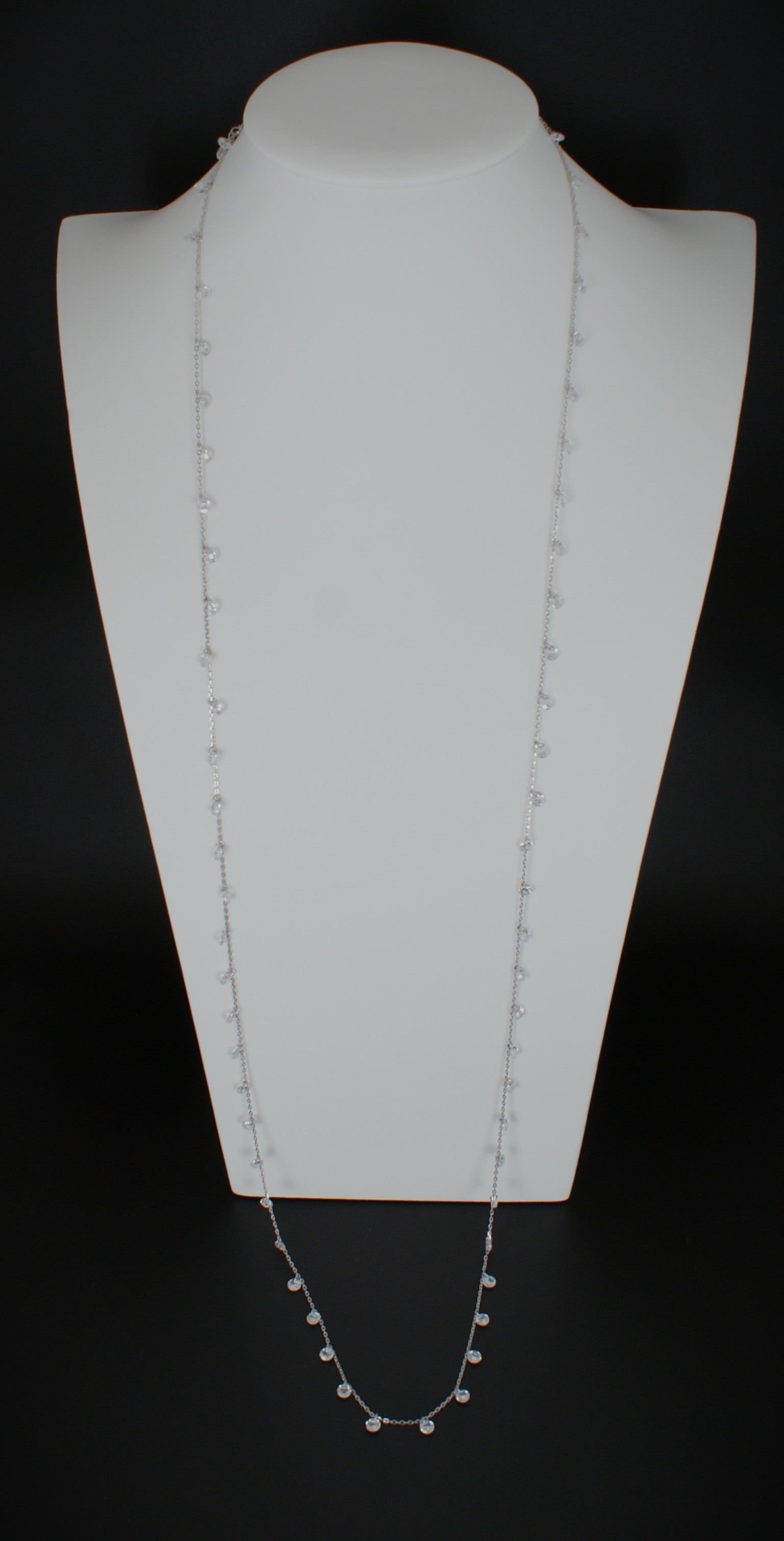 36 inch sterling silver diamond necklace with delicate bezel-set diamonds displayed on white jewelry bust