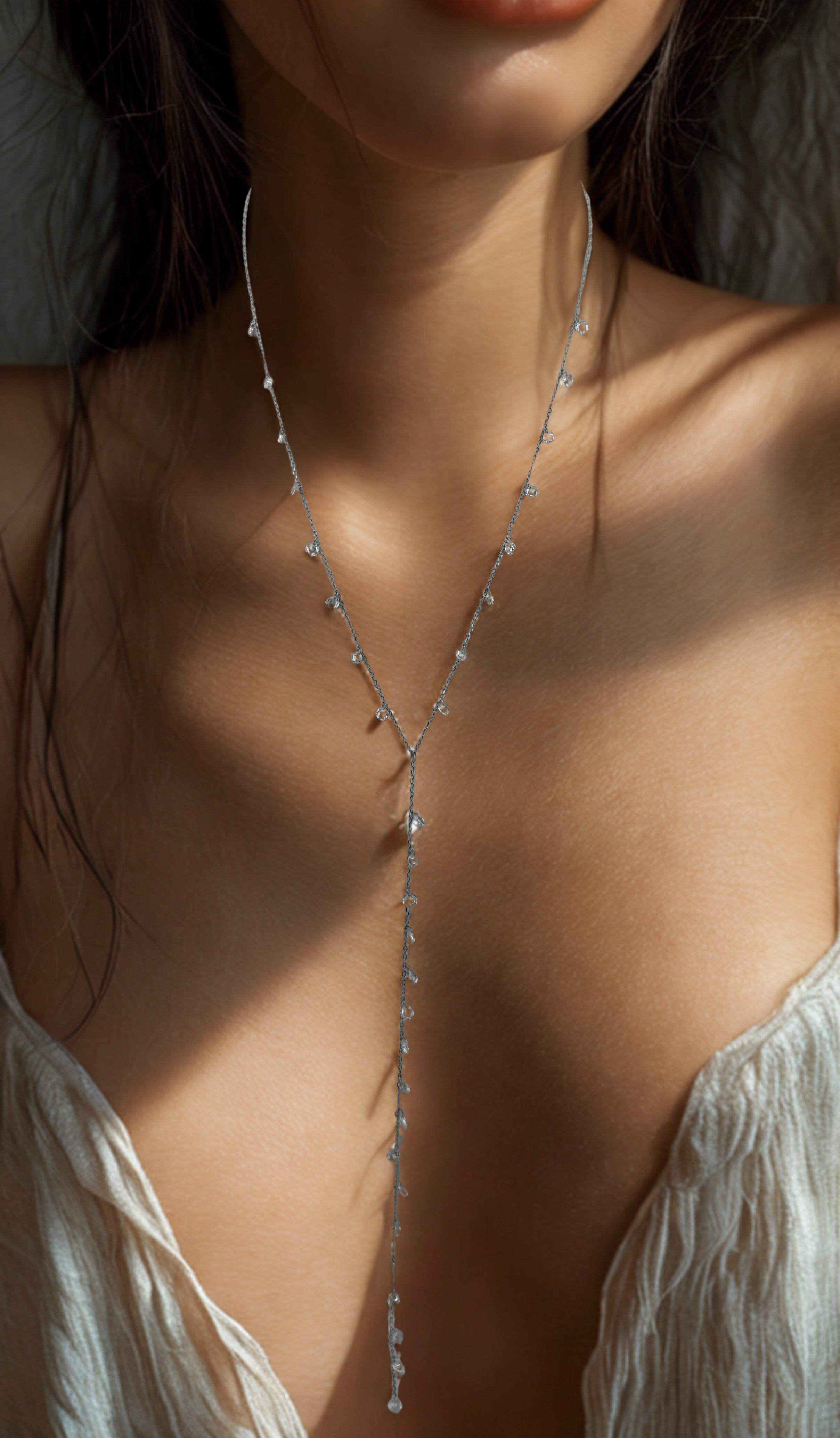 Be Je’s silver Y-shaped diamond necklace with delicate drop detail.