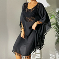 Black crochet beach cover-up dress with tassel trim and flowy sleeves