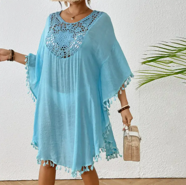 Blue crochet swim cover-up dress with tassel hem worn over bikini