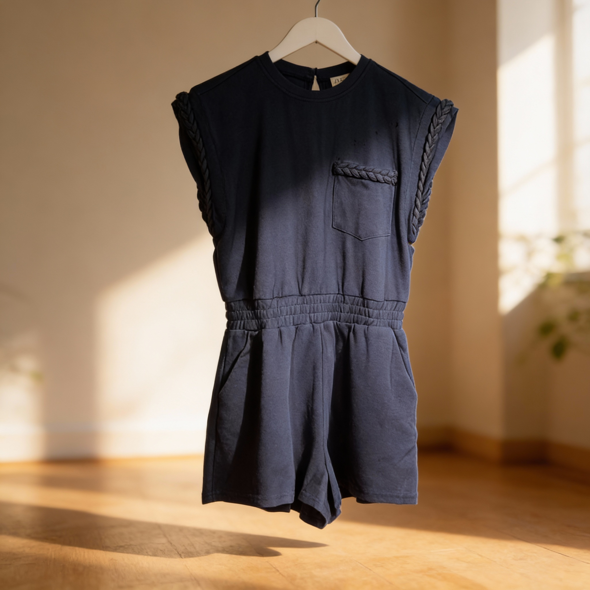 Luxury knit romper with braided accents for resort and casual wear