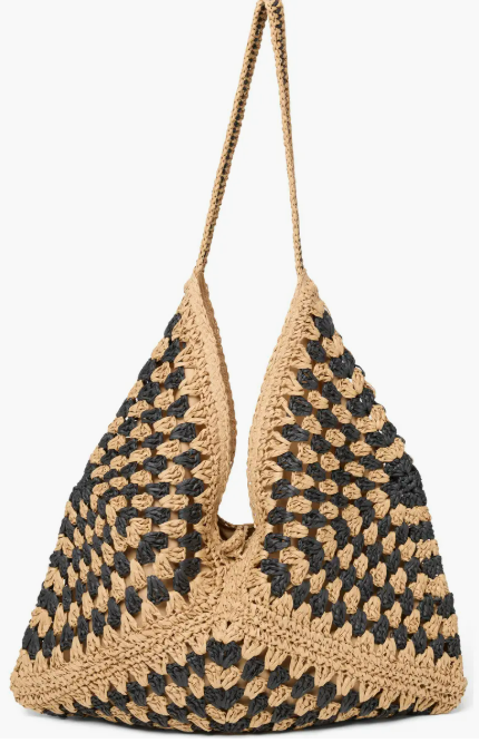 Woven handbag with black pattern on a white background