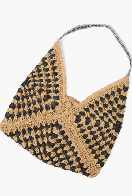 Handmade woven bag with black and beige pattern on a white background