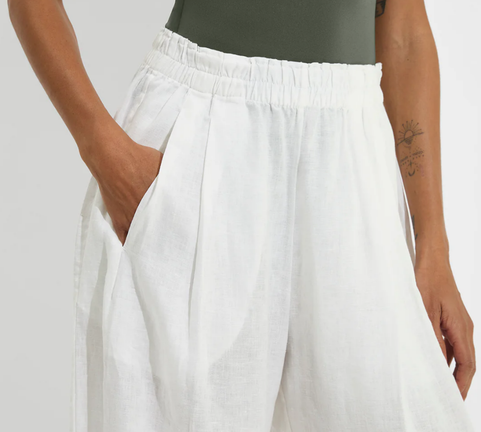 Lightweight white resort pants with elastic waist and functional side pockets
