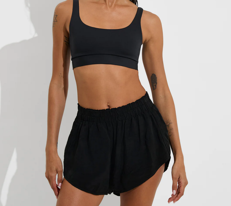 Black elastic waist shorts styled with black swim top