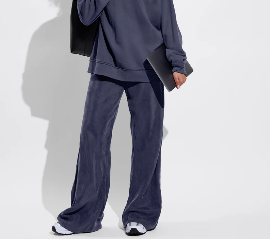 Navy flowy drawstring pants styled for coastal wear
