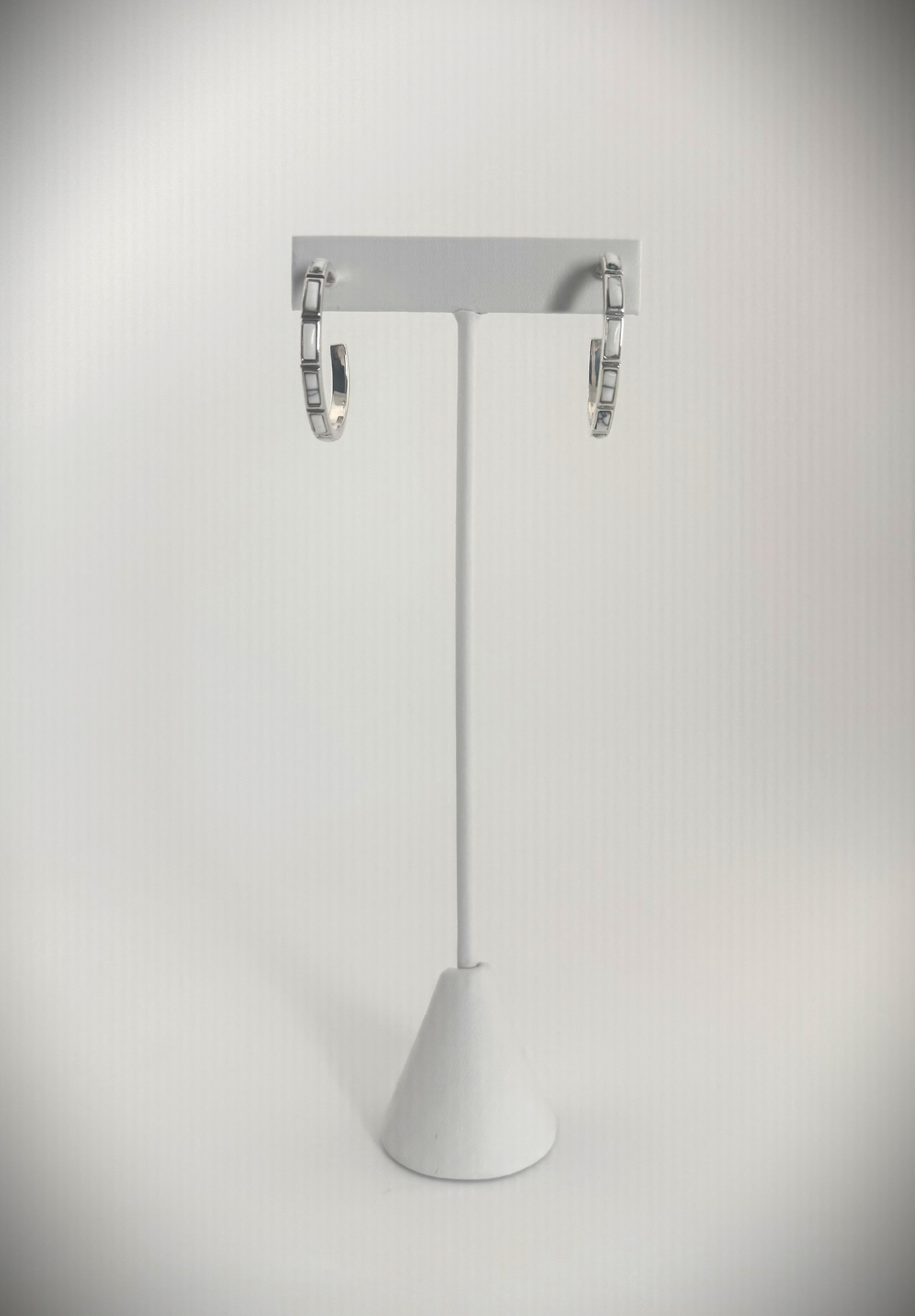 Sterling Silver White Howlite Hoop earings white back lit on earing stand