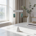 Sterling silver rectangular turquoise dangle earrings displayed on a minimalist white stand.