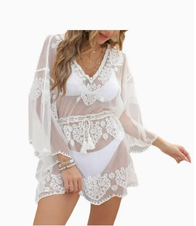 White boho lace beach cover-up with sheer embroidered details, worn over a swimsuit